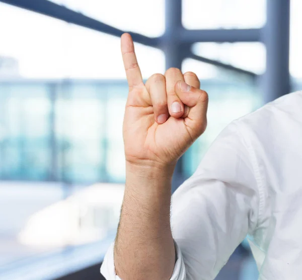 Jonge man hand met nummer één — Stockfoto