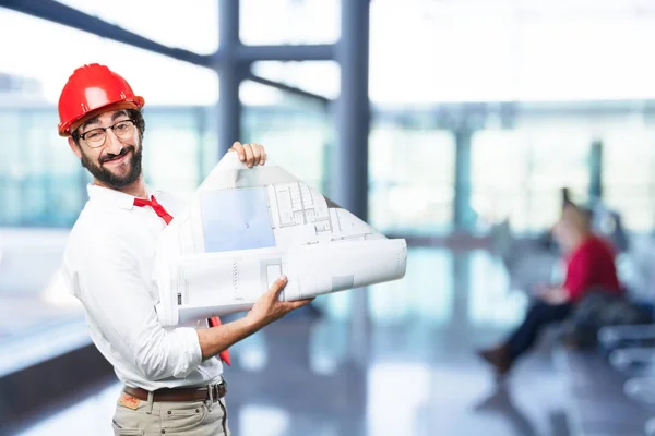Young funny architect with blueprint — Stock Photo, Image
