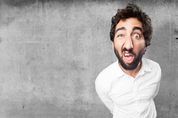 Homem em pose confusa com expressão surpresa — Fotografia de Stock