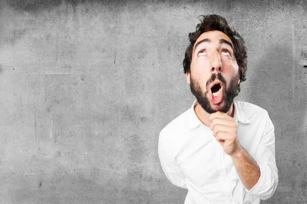 Funny man thinking with surprise expression — Stock Photo, Image