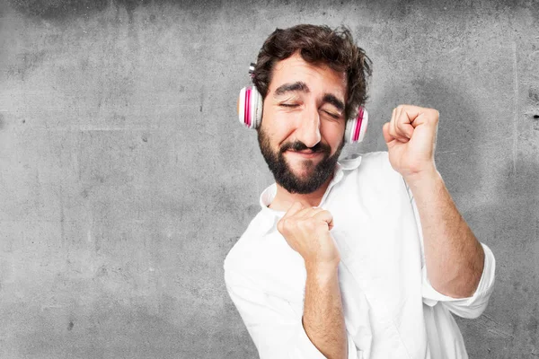 Joven divertido hombre con auriculares — Foto de Stock