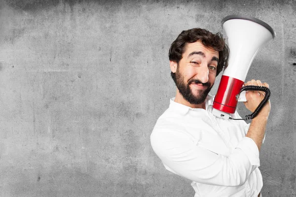 Jovem engraçado homem com megafone — Fotografia de Stock