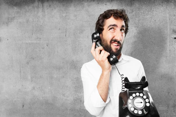 Man with vintage telephone and surprise expression — Stock Photo, Image