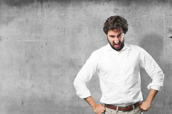 Young funny man with angry expression — Stock Photo, Image