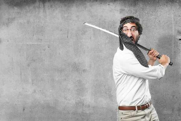 Joven divertido hombre con una espada — Foto de Stock