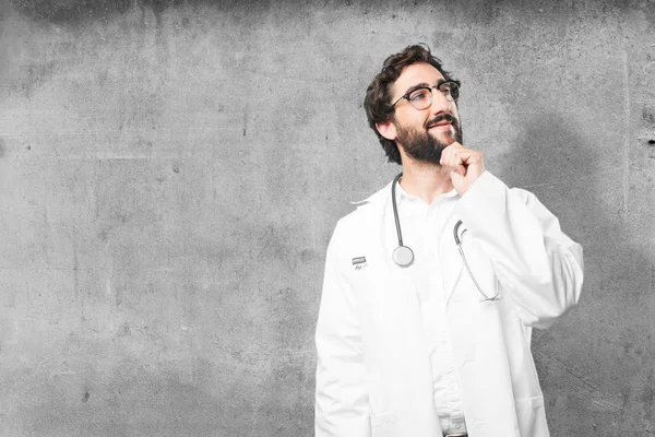 Young funny doctor thinking — Stock Photo, Image