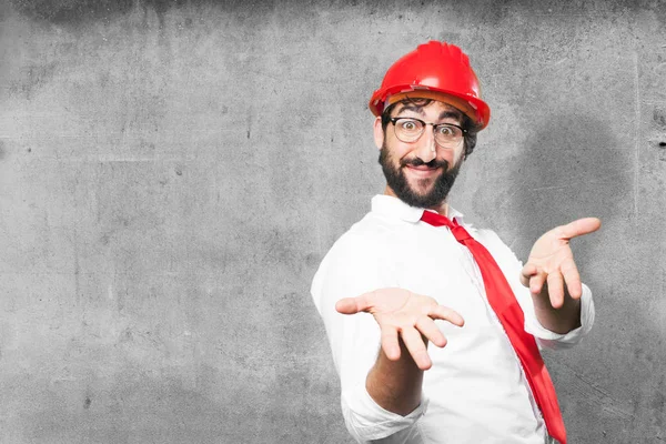 Young funny architect showing sign — Stock Photo, Image