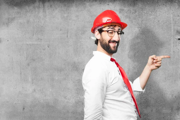 Young funny architect showing sign — Stock Photo, Image