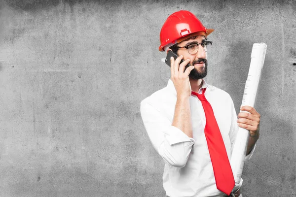 Young funny architect with mobile phone — Stock Photo, Image