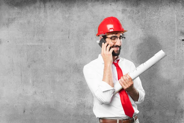 Young funny architect with mobile phone — Stock Photo, Image