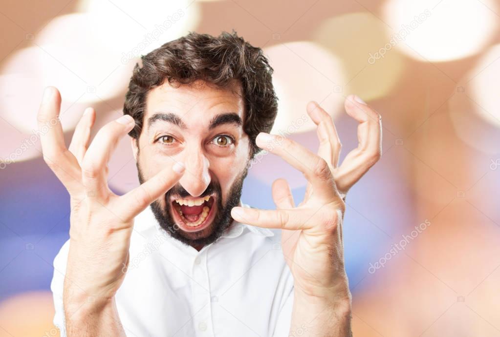 young funny man in angry pose