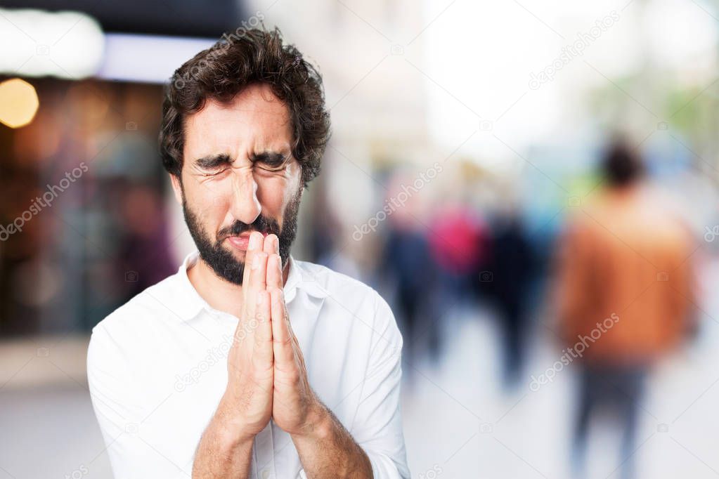 man praying in worried pose
