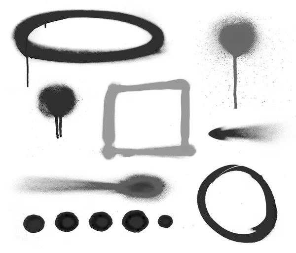 Black spray symbols against white background — Stock Photo, Image