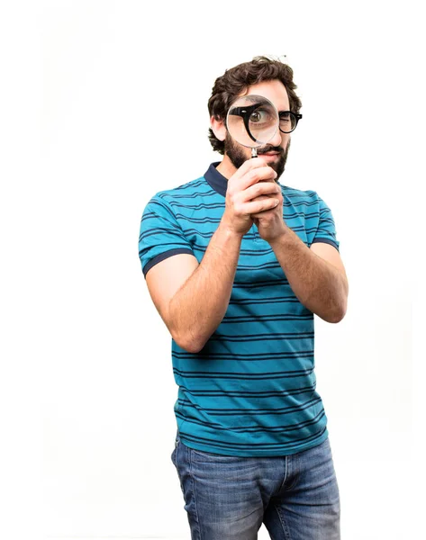 Young cool man with a magnifying glass — Stock Photo, Image