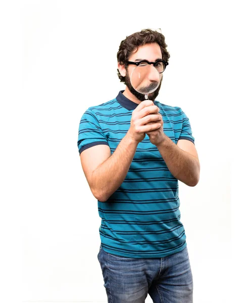 Young cool man with a magnifying glass — Stock Photo, Image