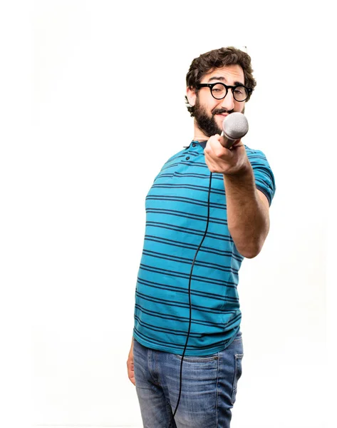 Jovem homem legal com um microfone — Fotografia de Stock