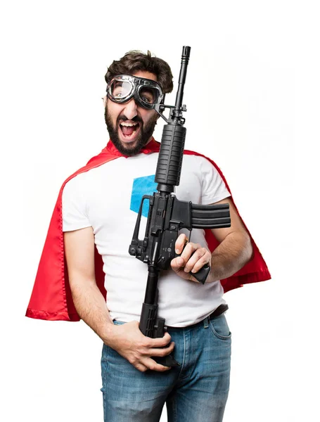 Young super hero with a rifle — Stock Photo, Image