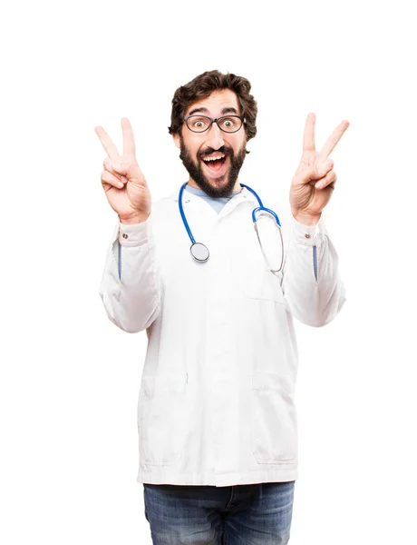 Молодой врач со знаком победы — стоковое фото