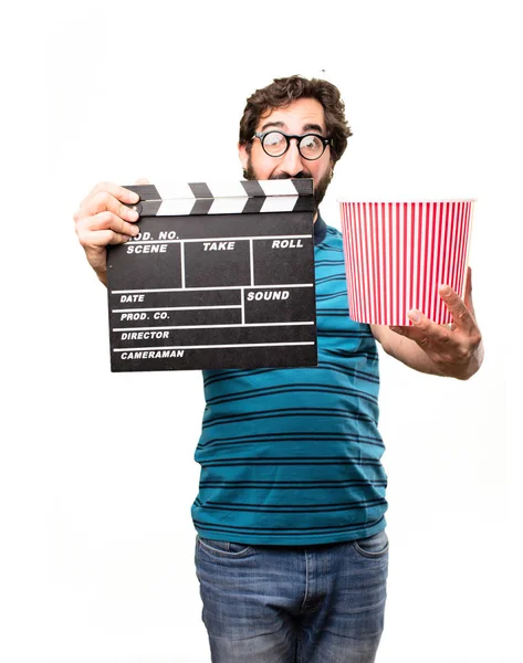 Cool man med en kläpp och popcorn — Stockfoto