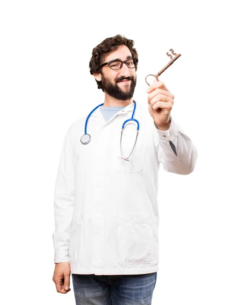 Jonge dokter man met oude sleutel — Stockfoto