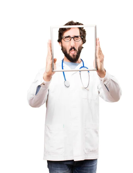 Człowiek młody lekarz z ramką — Zdjęcie stockowe