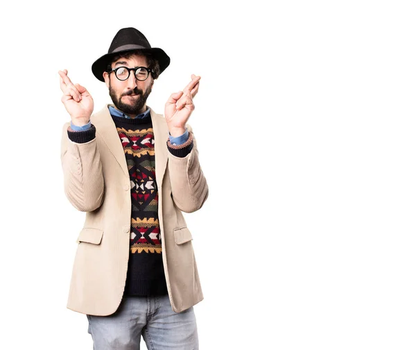 Young cool hipster with finger crossing — Stock Photo, Image