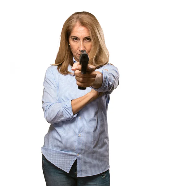 Senior beautiful woman with a gun — Stock Photo, Image