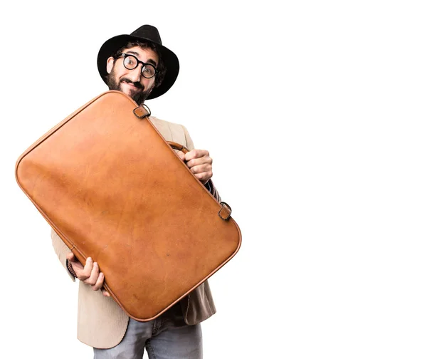 Jonge coole hipster met een koffer — Stockfoto