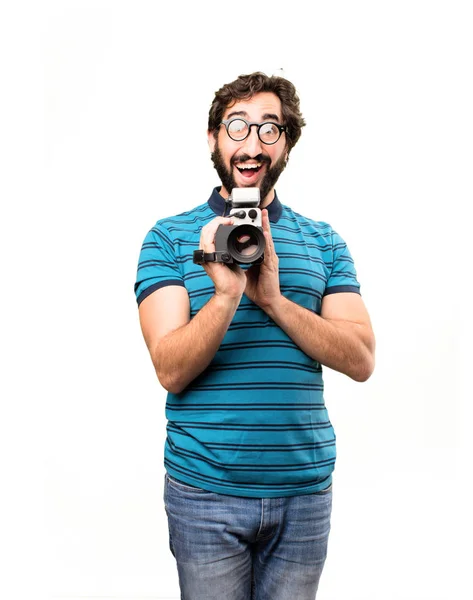 Jovem homem legal com uma câmera de cinema — Fotografia de Stock