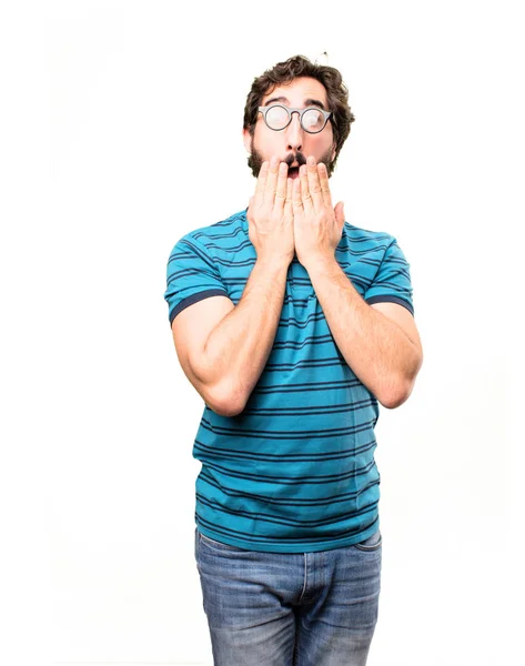 Ung cool man täcker munnen — Stockfoto