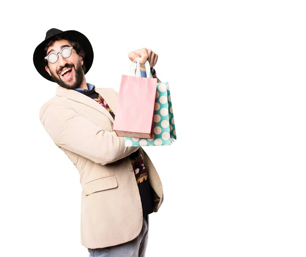 Joven hipster fresco con bolsas de compras — Foto de Stock
