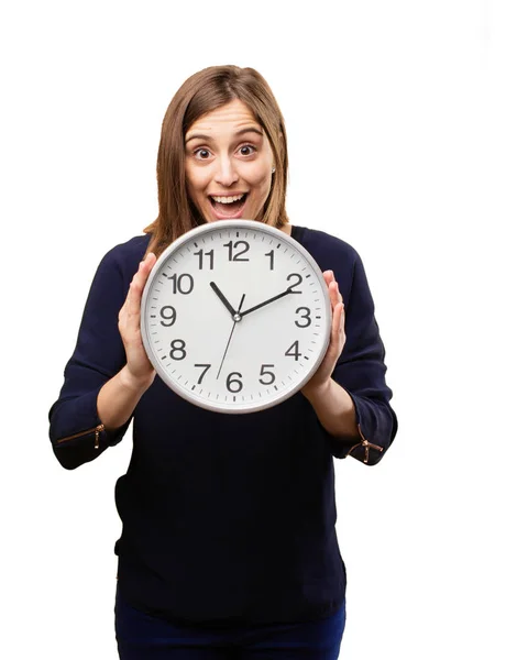 Surprised pretty woman with a clock — Stock Photo, Image