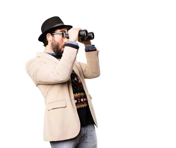 Jonge coole hipster met verrekijker — Stockfoto