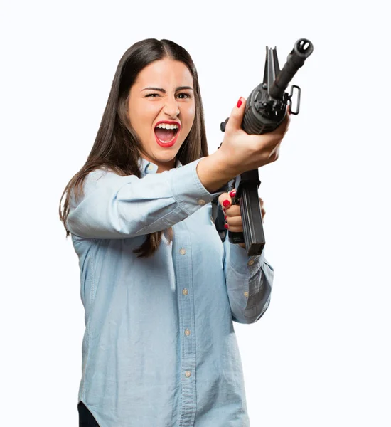 Jovem menina legal com uma arma — Fotografia de Stock
