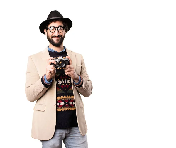 Jonge coole hipster met vintage camera — Stockfoto