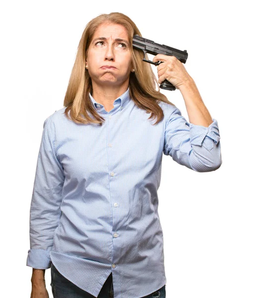 Senior beautiful woman with a gun — Stock Photo, Image