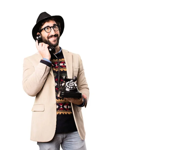 Joven hipster fresco con un teléfono vintage — Foto de Stock