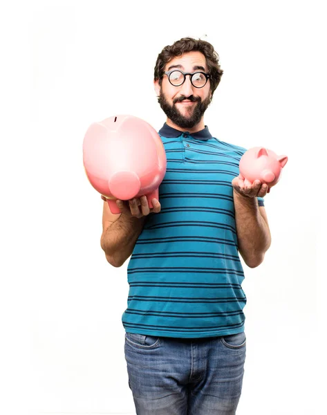 Young cool man with a piggy banks — Stock Photo, Image