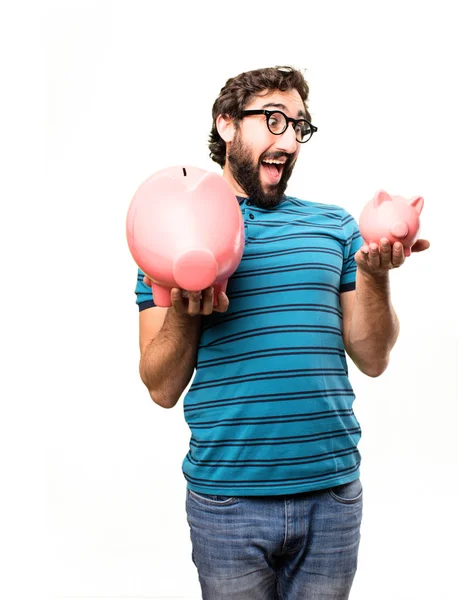 Jovem homem legal com um porquinho bancos — Fotografia de Stock