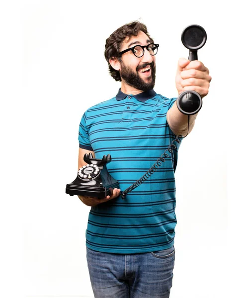 Jovem homem legal com um telefone vintage — Fotografia de Stock