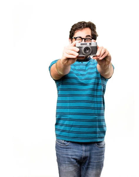 Jovem homem legal com uma câmera velha — Fotografia de Stock