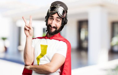 zafer işareti ile genç süper kahraman