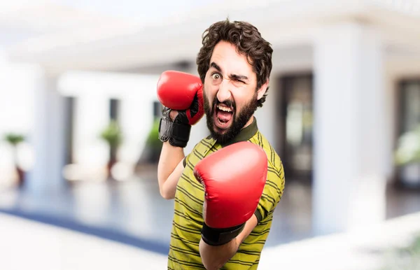 Jovem homem legal com luvas de boxe — Fotografia de Stock