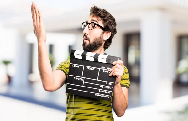 Young cool man with a clapper — Stock Photo, Image