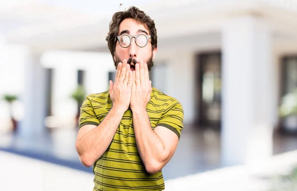 Jovem legal homem cobrindo boca — Fotografia de Stock