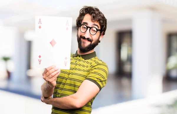 Junger cooler Mann mit Poker-Ass — Stockfoto