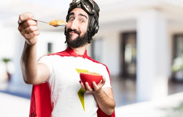 Joven super héroe desayunando —  Fotos de Stock