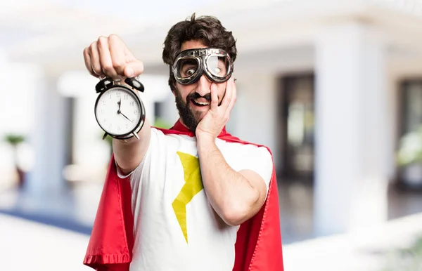 Young super hero with a clock — Stock Photo, Image