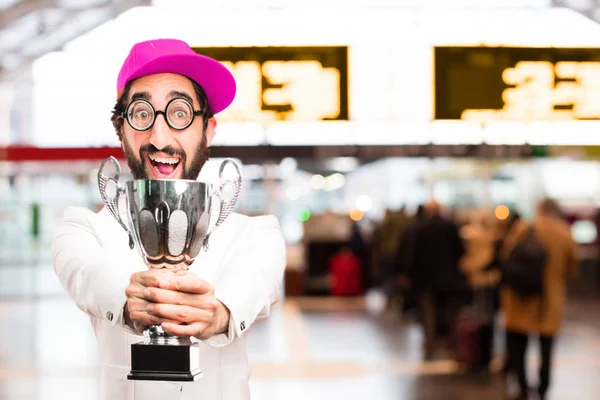 Joven empresario loco con un trofeo — Foto de Stock