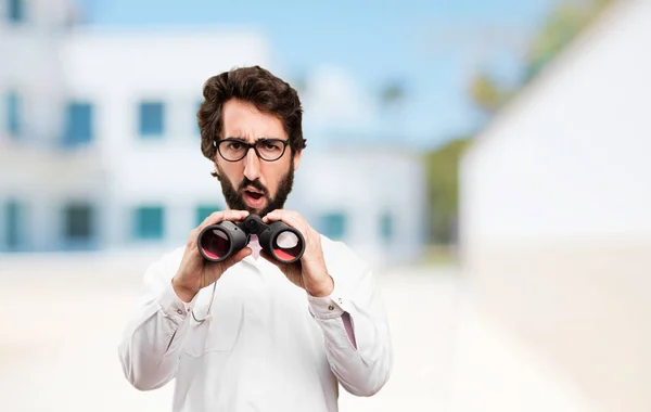 Young doctor man with binoculars — Stock Photo, Image